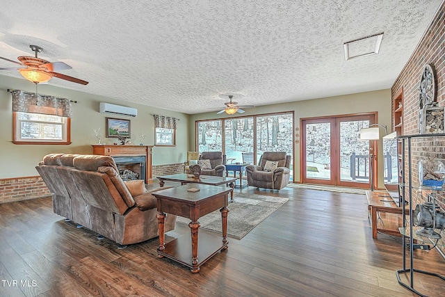 living room with ceiling fan, dark wood-type flooring, and brick wall