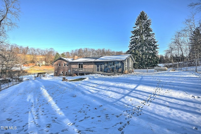 view of snow covered property