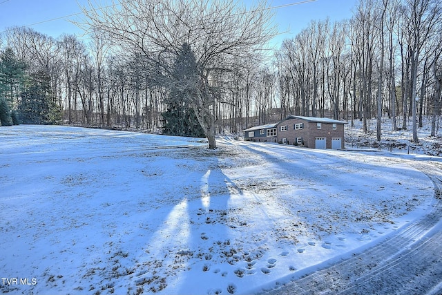 view of yard layered in snow