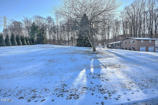 view of yard covered in snow