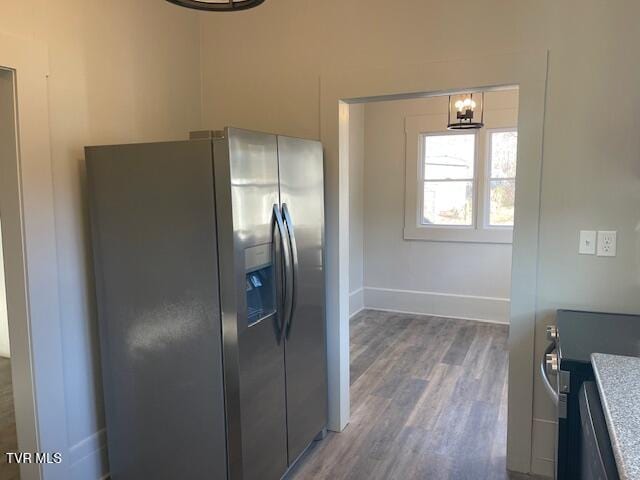 kitchen with dark wood-type flooring and appliances with stainless steel finishes