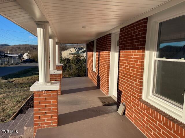 view of patio featuring a porch