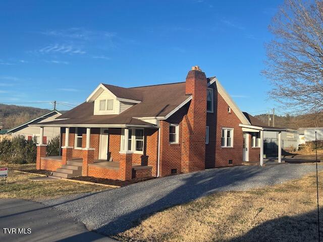 view of property exterior with covered porch