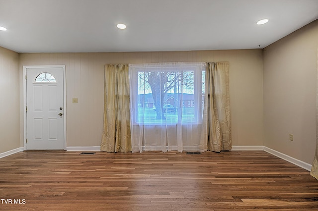 foyer with dark wood-type flooring