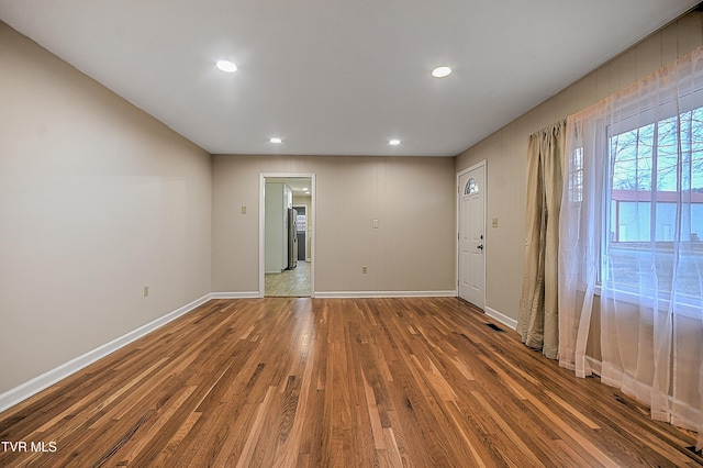 empty room featuring wood-type flooring