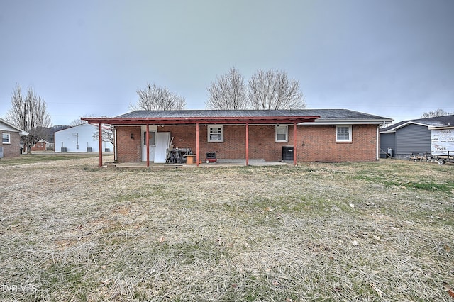 back of house with a patio