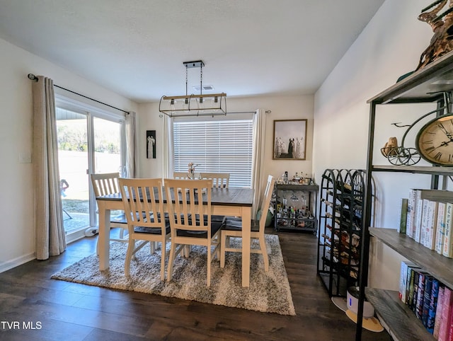 dining area featuring dark hardwood / wood-style flooring