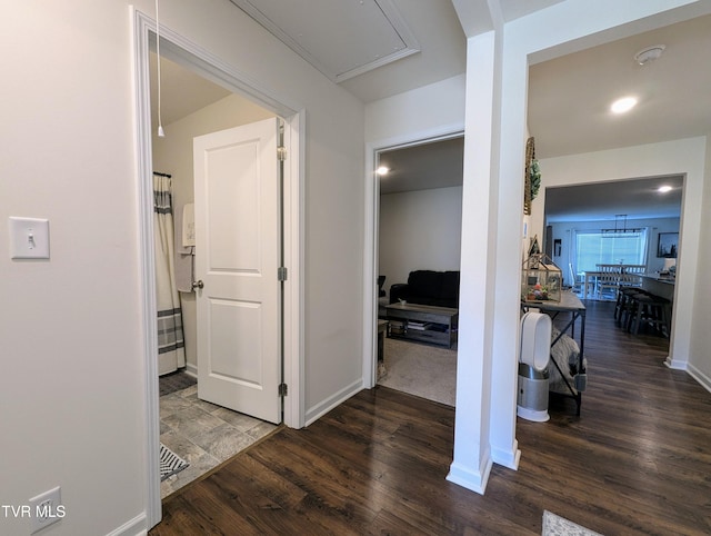 hall with dark wood-type flooring