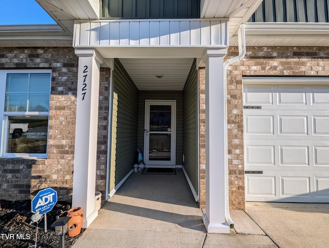 doorway to property featuring a garage