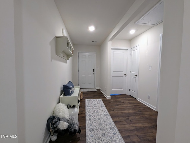 entryway with dark hardwood / wood-style flooring