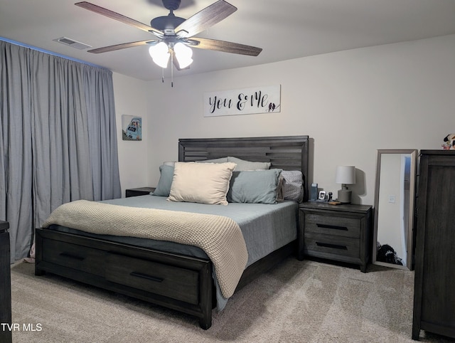 carpeted bedroom with ceiling fan