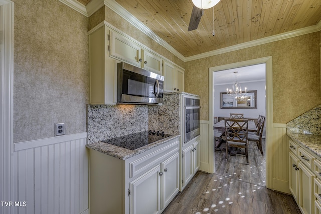 kitchen with wooden ceiling, appliances with stainless steel finishes, hanging light fixtures, crown molding, and light stone counters