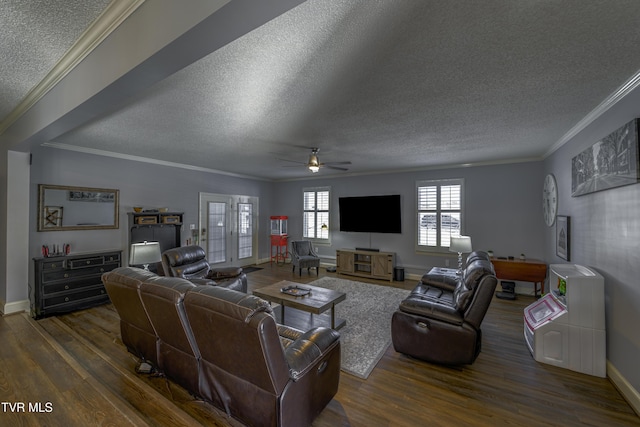 living room featuring a textured ceiling, ceiling fan, crown molding, and dark wood-type flooring