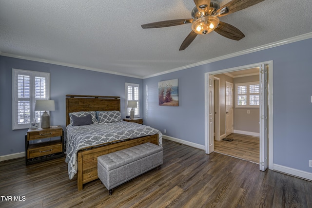 bedroom with ceiling fan, dark wood-type flooring, ornamental molding, a textured ceiling, and ensuite bathroom