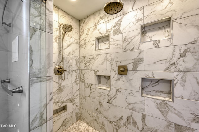 bathroom with tiled shower