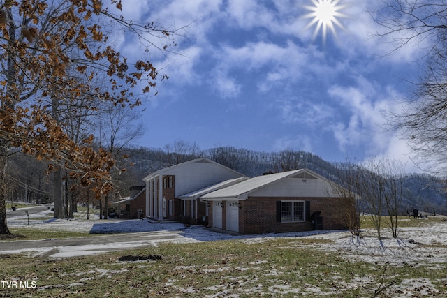 view of side of property featuring a garage