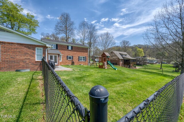 204 Amity Dr, Bristol, TN 37620 - view of yard featuring a fenced backyard and a playground