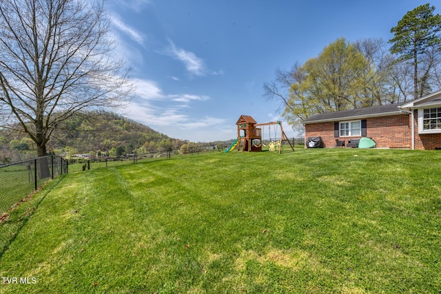 204 Amity Dr, Bristol, TN 37620 - view of yard featuring a fenced backyard and a playground