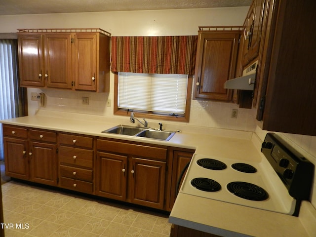 kitchen featuring sink and electric stove