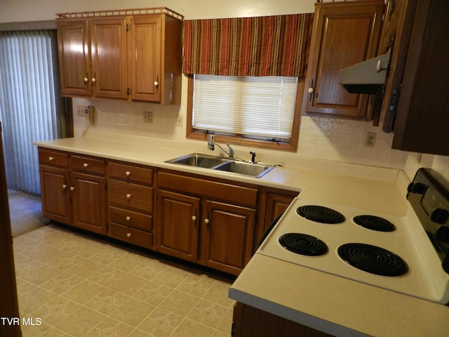 kitchen featuring sink and electric range oven