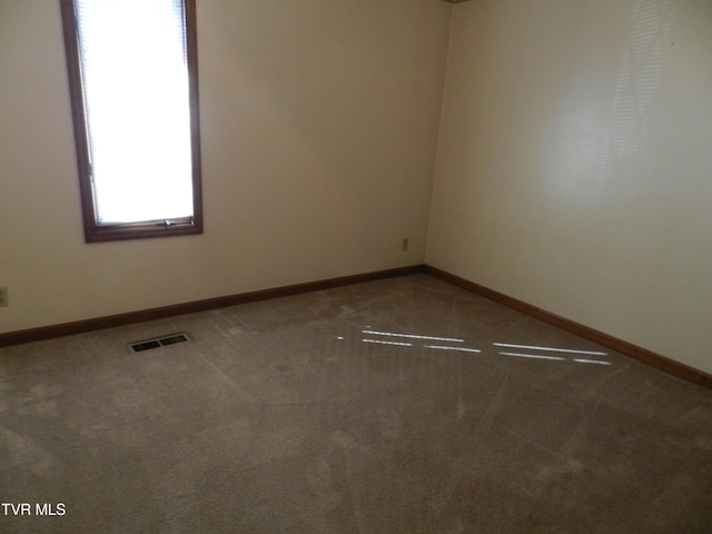 unfurnished room with carpet floors