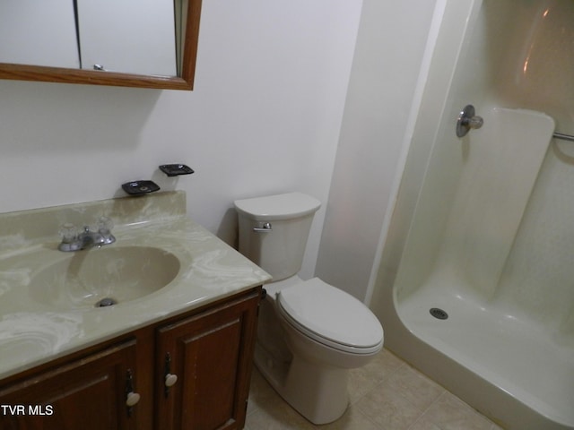 bathroom featuring a shower, vanity, and toilet