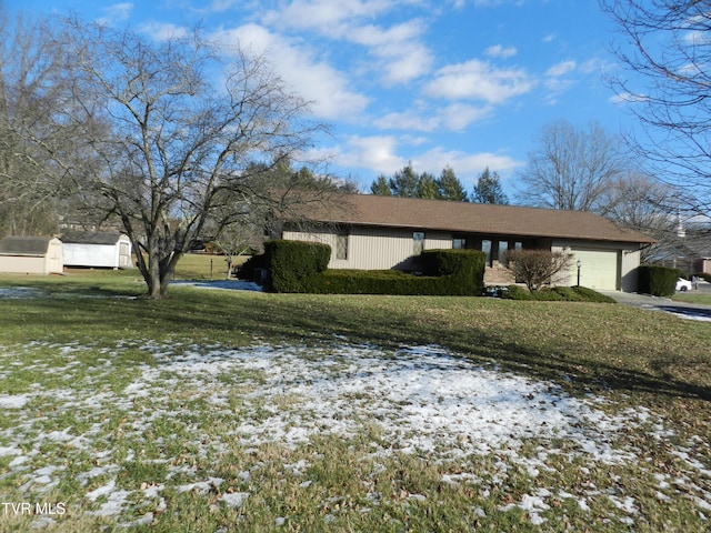 exterior space with a yard and a garage