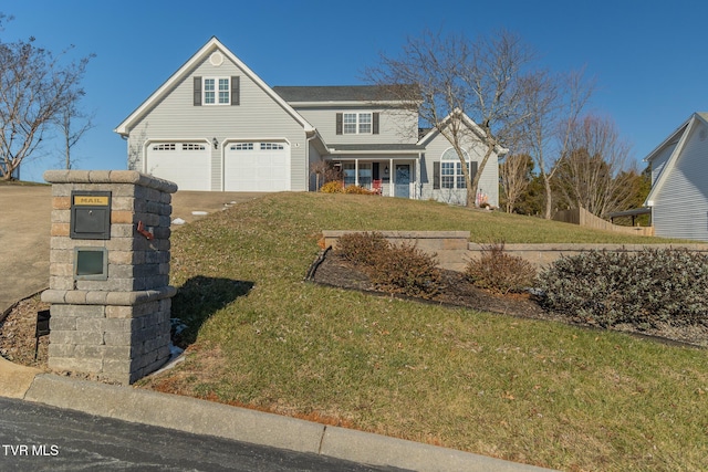 front facade with a garage and a front yard