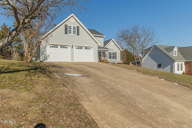 front of property with a garage and a front yard