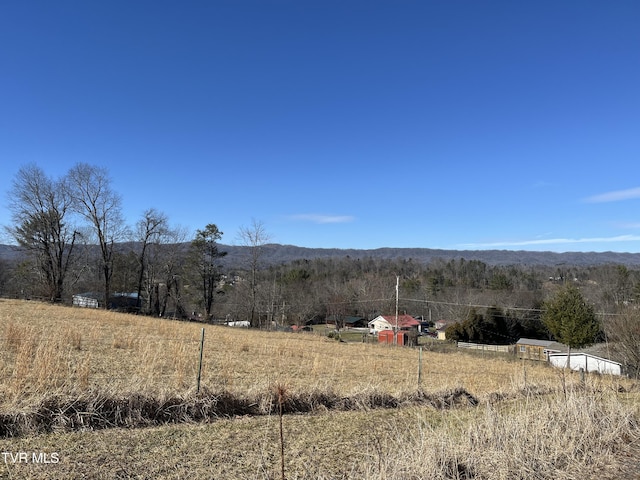 mountain view featuring a rural view