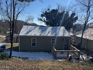 back of house featuring a deck