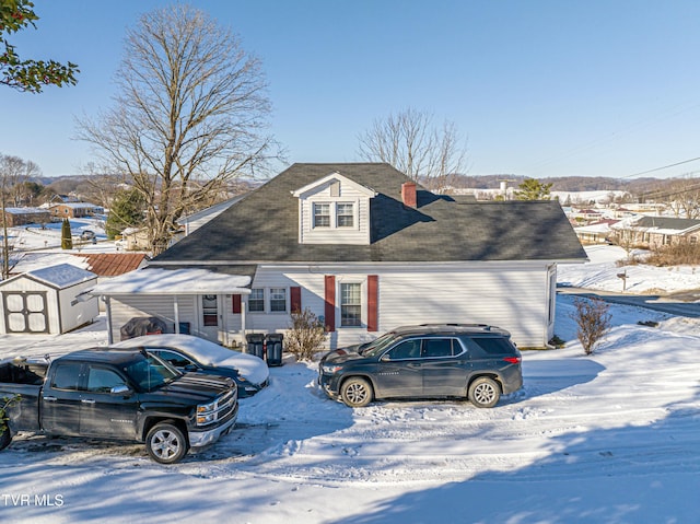 view of front of house featuring a storage shed