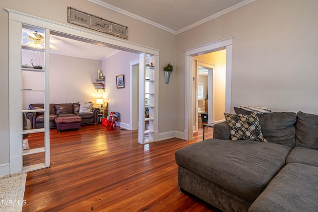 living room with ornamental molding and dark hardwood / wood-style floors