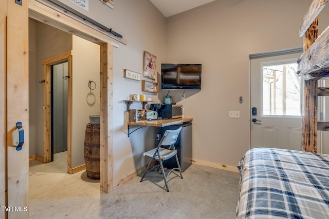 bedroom featuring concrete floors