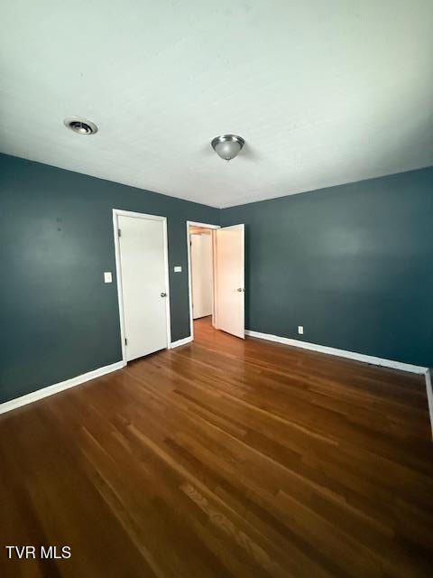 unfurnished bedroom featuring wood-type flooring