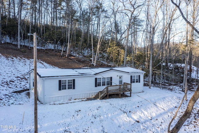 view of front of property with a wooden deck