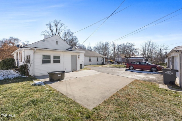 rear view of property with a lawn