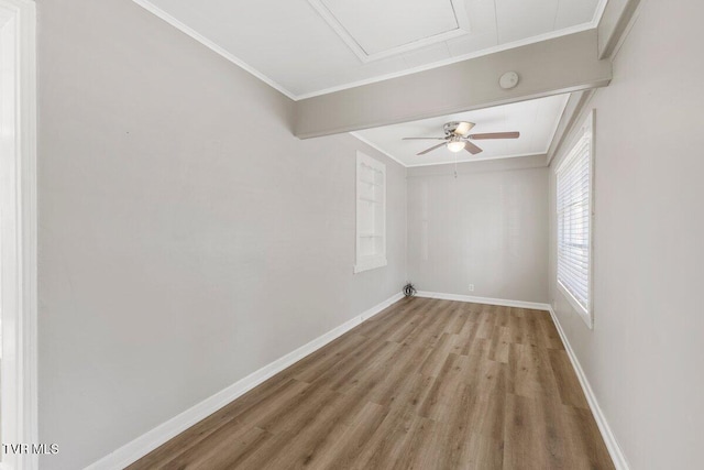 unfurnished room with ceiling fan, crown molding, and hardwood / wood-style floors