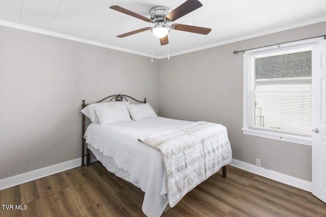 bedroom with ceiling fan, dark hardwood / wood-style flooring, and ornamental molding