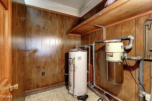 utility room featuring gas water heater