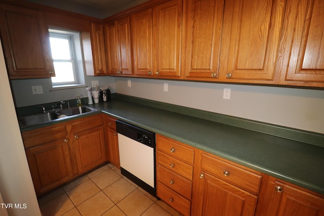 kitchen with light tile patterned flooring, dishwasher, and sink