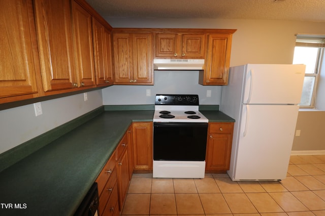 kitchen with white fridge, light tile patterned flooring, a textured ceiling, and electric range