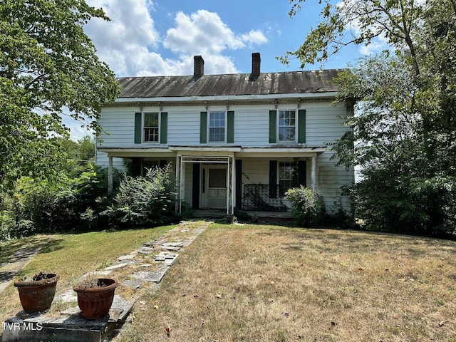 front of property with a front lawn and a porch