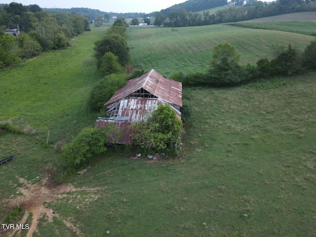 birds eye view of property with a rural view