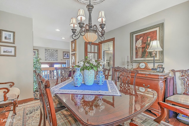 dining space with a chandelier