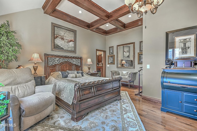 bedroom featuring a notable chandelier, light hardwood / wood-style floors, coffered ceiling, and beamed ceiling