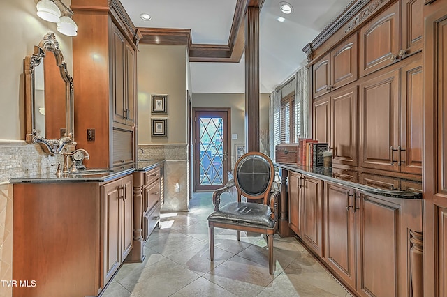 interior space featuring vanity and crown molding