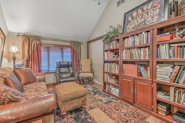 living area with vaulted ceiling