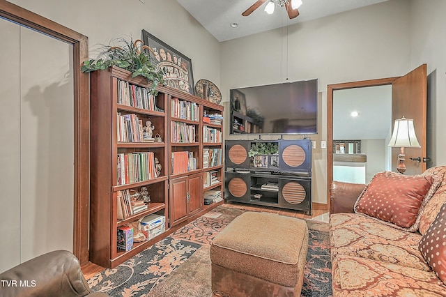 living room with ceiling fan and vaulted ceiling