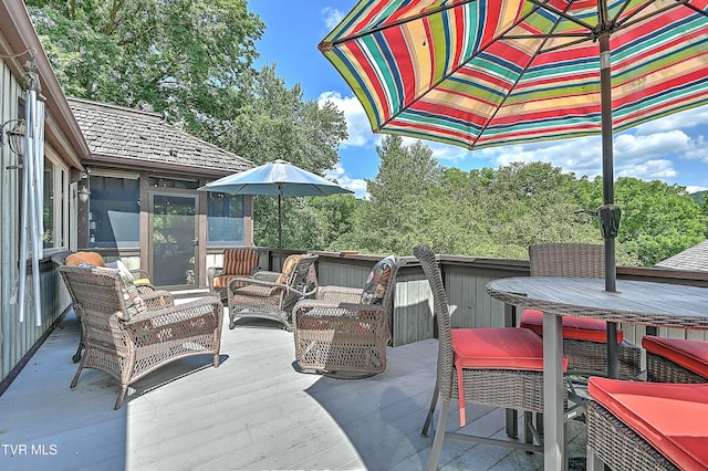 view of patio featuring a wooden deck and an outdoor hangout area